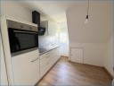 Erstbezug - heimelige 4,5 Zi.-Wohnung im OG und DG mit Fernblick und Garage!