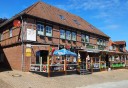 Gstehaus mit elf Ferienapartments, zwei Gastronomieeinheiten und Baugrundstck inklusive